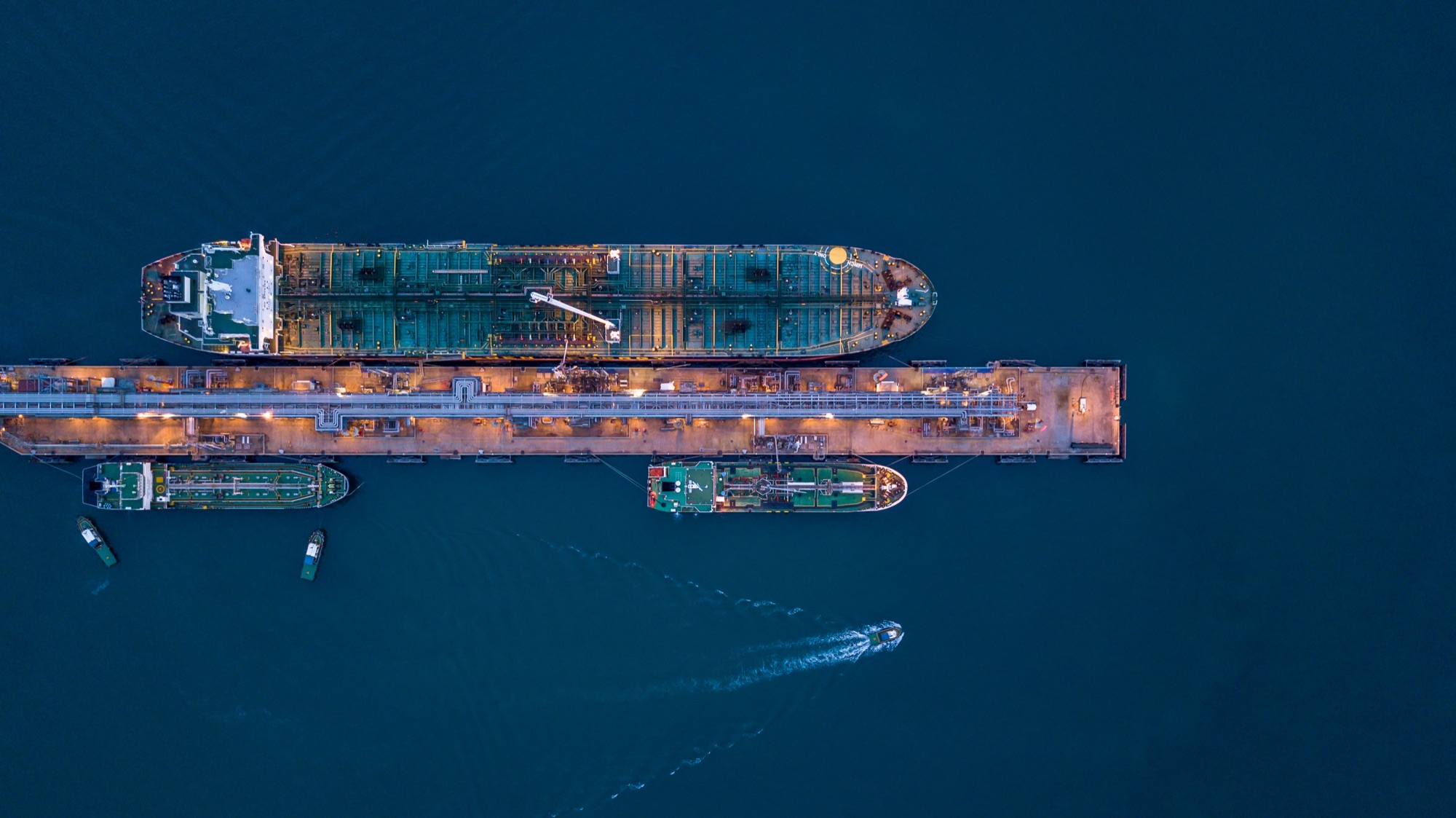 Aerial view of a crude oil tanker berthed at a marine terminal