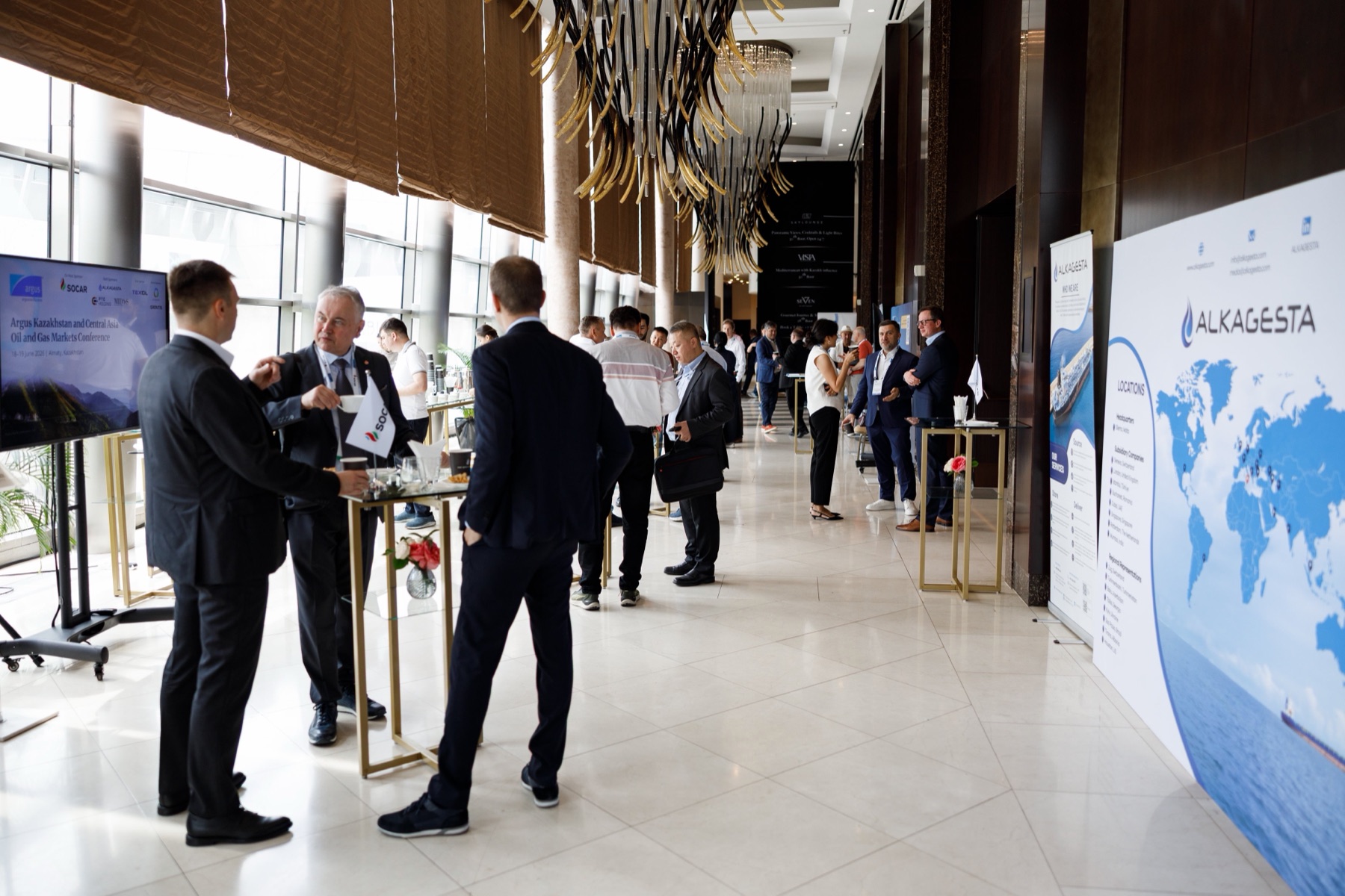 Delegates meeting in the conference exhibition area