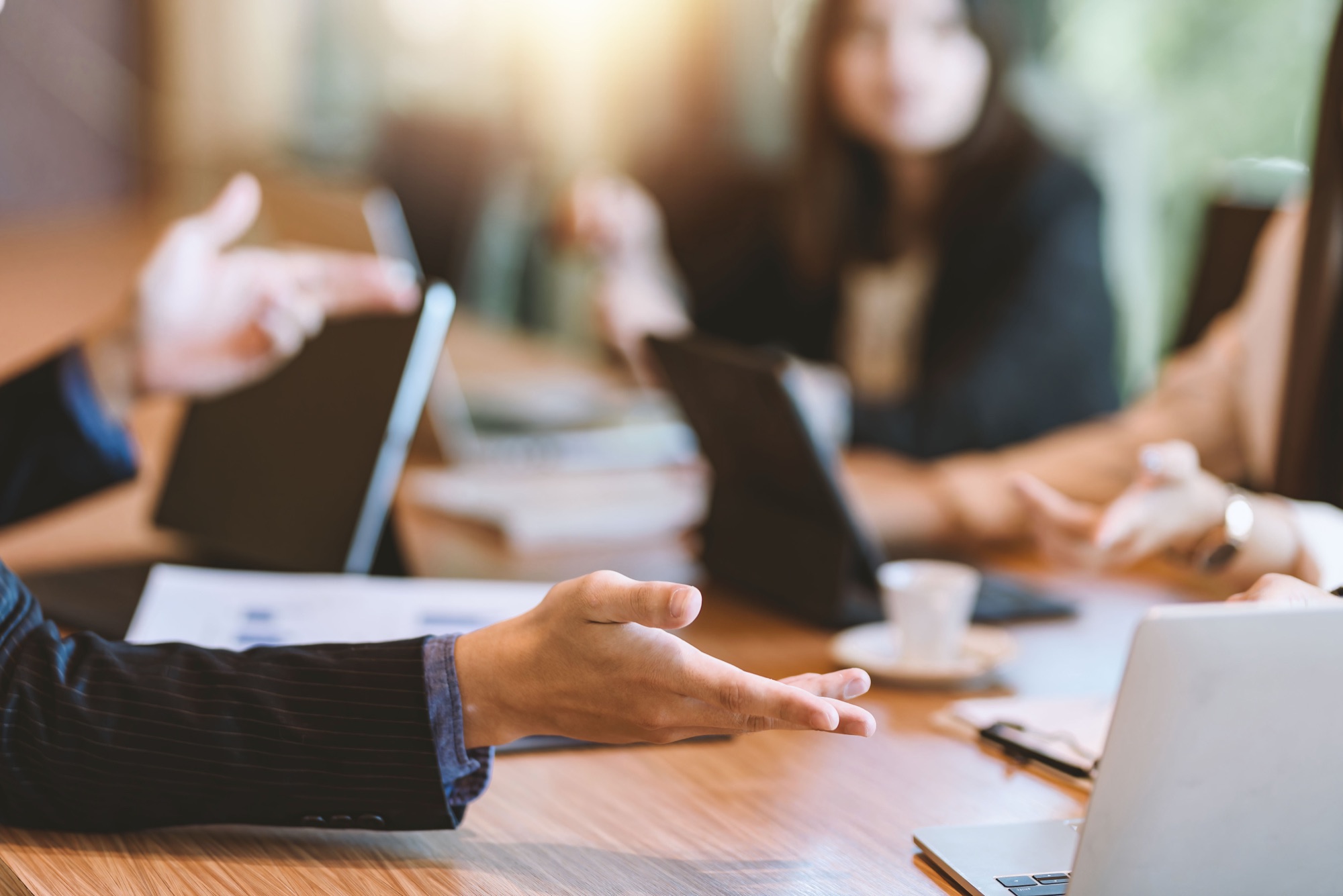 Professionals reviewing a transaction file in a meeting